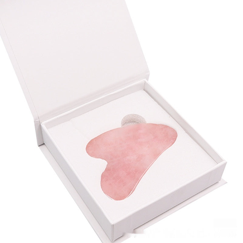 Pierre gua sha en quartz rose pour sculpter le visage
